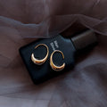 Gold Tone Polished Geometric C Shape Thick Hoop Earrings view 1
