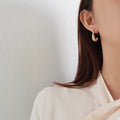 Gold Tone Polished Geometric C Shape Thick Hoop Earrings view 3