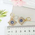 Gold Tone Crystal Blue Evil Eye Huggie Drop Earrings view 5
