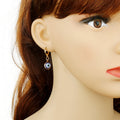 Gold Tone Small Round Evil Eye Huggie Drop Earrings in Three Designs view 4