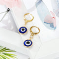 Gold Tone Small Round Evil Eye Huggie Drop Earrings in Three Designs view 6