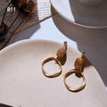 Gold Geometric Dangle Earrings Amber Stone Knot Variants view 7