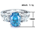 Blue Oval Stone Clear Side Stone Silver Tone Ring Jewelry Accessory view 5
