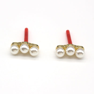 Main product view of three Pearl Row Stud Earrings with Gold Tone Posts