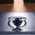 Silver Tone Ring with Deep Blue Round Center Stone view 4