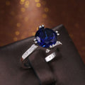 Silver Tone Ring with Deep Blue Round Center Stone view 3
