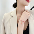 Pink Beaded Stretch Bracelet With Pearl Like Dangle Charms view 2