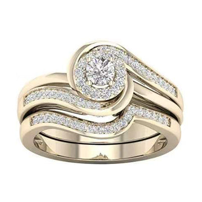金色旋涡双层套戒 front view showing layered gold-tone wave bands curling around a clear round cluster