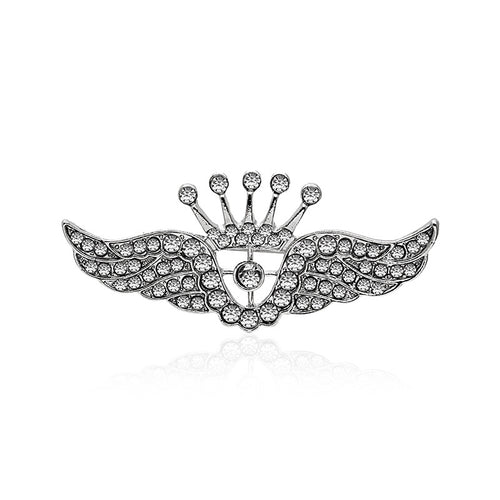 Silver rhinestone crown wings brooch isolated on white with reflection