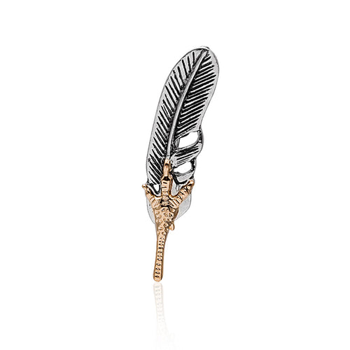 Silver feather gold eagle claw brooch upright on white reflection