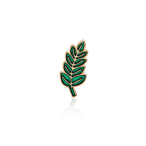 Green enamel gold-outline leaf brooch isolated on white with reflection