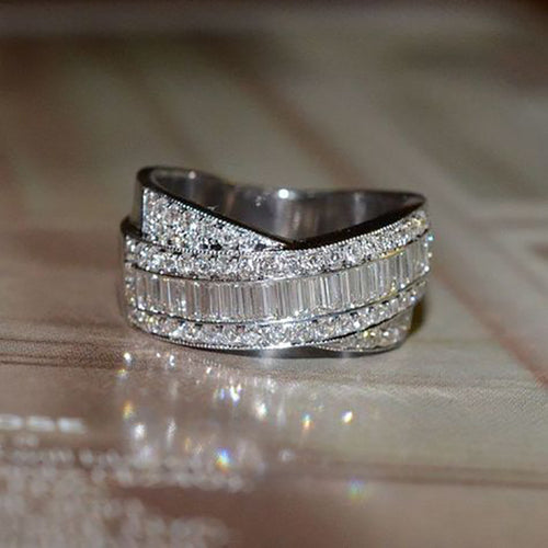 Side angle of white gold crossed multi-band baguette crystal twist ring