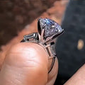 Silver Tone Raised Round Solitaire Ring with Side Stones view 2