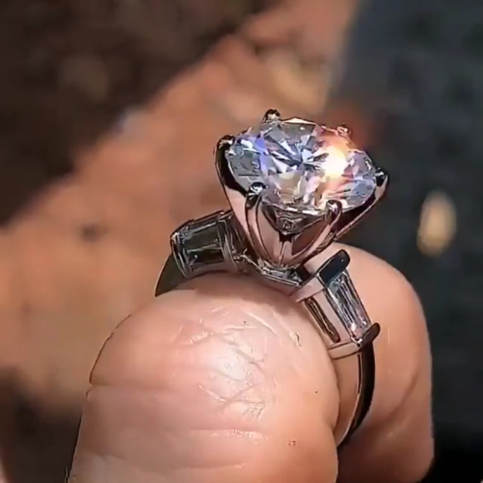 Silver Tone Raised Round Solitaire Ring with Side Stones