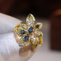 Blue Marquise Stone Flower Ring In Gold Tone Setting view 2