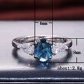 Silver Tone Oval Blue Stone Ring with Clear Side Stones view 5