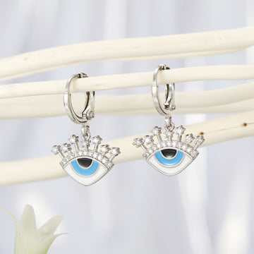 Crowned Blue Evil Eye Huggie Earrings in Two Finishes