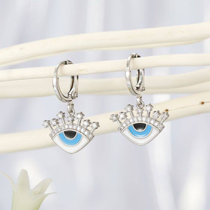 Crowned Crystal Evil Eye Huggie Drop Earrings in Two Finishes