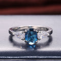 Silver Tone Oval Blue Stone Ring with Clear Side Stones view 6