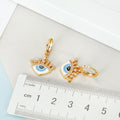 Crowned Crystal Evil Eye Huggie Drop Earrings in Two Finishes view 3