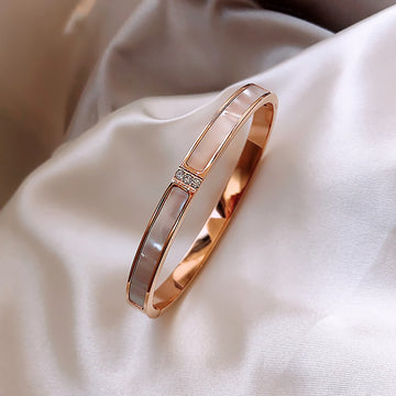 Four Gold Tone Bangle Styles With Shell Inlay And Crystal Details