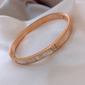 Four Gold Tone Bangle Styles With Shell Inlay And Crystal Details view 6