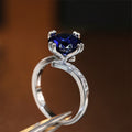 Silver Tone Ring with Deep Blue Round Center Stone view 2
