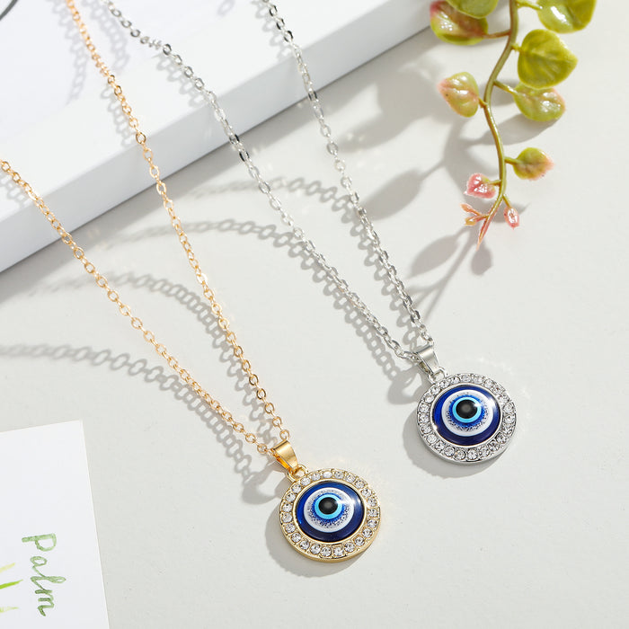 Fourteen Millimeter Crystal Evil Eye Pendant Necklaces in Two Finishes