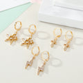 Gold Tone Crystal Huggie Drop Earrings in Three Symbol Designs view 5
