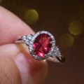 Red Oval Halo Three-Stone Ring In Polished Silver Tone view 1