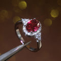 Red Oval Halo Three-Stone Ring In Polished Silver Tone view 2