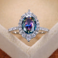 Iridescent Oval Stone Floral Halo Ring In Polished Silver Tone view 1