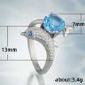 Blue Stone Dolphin Ring With Curved Silver Tone Band view 3
