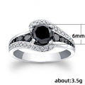 Black And Blue Round Stone Swirl Ring In Four Metal Finishes view 5