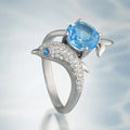 Blue Stone Dolphin Ring With Curved Silver Tone Band view 2