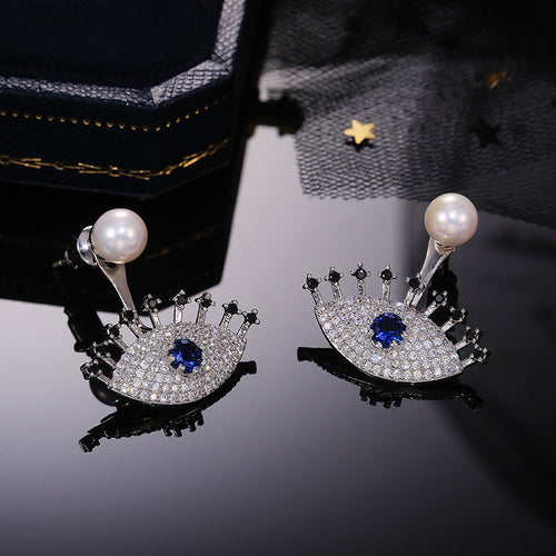 Blue Eye Faux Pearl Jacket Earrings styled close-up