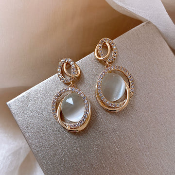 Gold Cat Eye Oval Drop Earrings with Sculpted Polished Metal Details