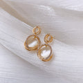 Gold Cat Eye Oval Drop Earrings with Sculpted Polished Metal Details view 4