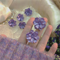 Purple Flower Stud Earrings with Sculpted Polished Metal Details view 3
