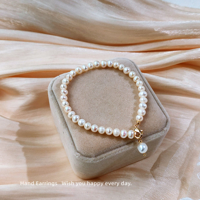 White Pearl Like Strand Bracelet With Single Drop Accent
