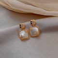 Geometric Cat Eye Earring Collection with Sculpted Polished Metal Details view 4
