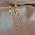 Geometric Cat Eye Earring Collection with Sculpted Polished Metal Details view 6