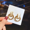 Geometric Cat Eye Earring Collection with Sculpted Polished Metal Details view 10