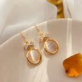 Geometric Cat Eye Earring Collection with Sculpted Polished Metal Details view 7