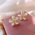 Geometric Cat Eye Earring Collection with Sculpted Polished Metal Details view 5