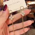 Geometric Cat Eye Earring Collection with Sculpted Polished Metal Details view 9