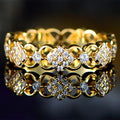 Gold Tone Openwork Floral Eternity Ring With Clear Stones view 1