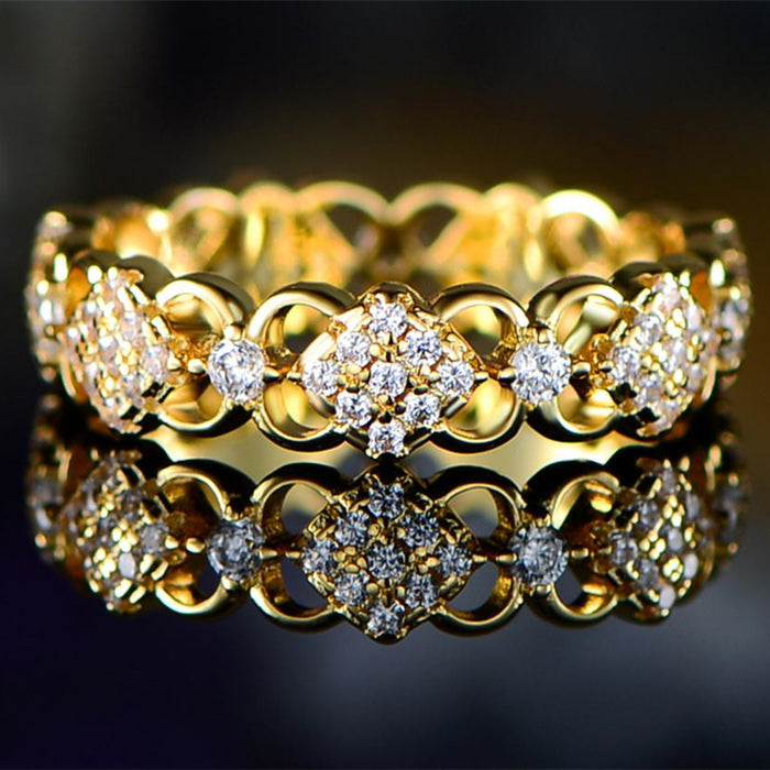 Gold Tone Openwork Floral Eternity Ring With Clear Stones