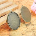 Oval Rope Edge Pendant Trays in Antique Bronze and Silver view 2