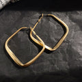 Gold Geometric Hoop Earring Collection with Sculpted Polished Metal Details view 5